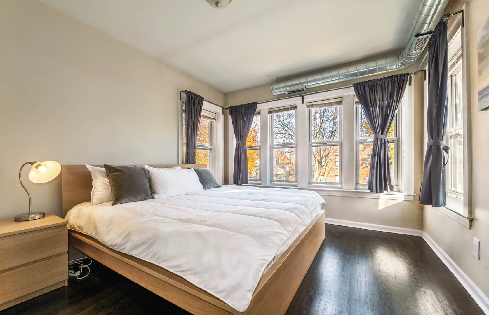 4136 West Palmer Street Chicago, IL 60639 - Photo 11 of 35 a bedroom with a large bed and a large window