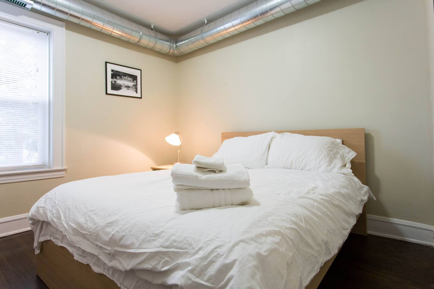 4136 West Palmer Street Chicago, IL 60639 - Photo 21 of 35 a large bed sitting in a bedroom next to a window