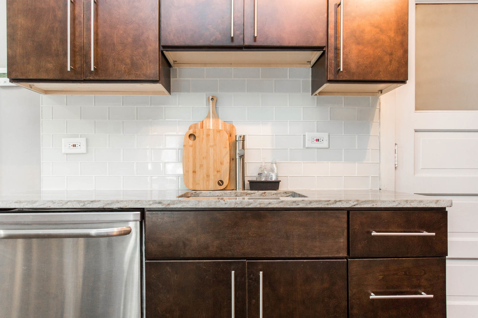 4136 West Palmer Street Chicago, IL 60639 - Photo 23 of 35 a kitchen with granite countertop a sink and cabinets