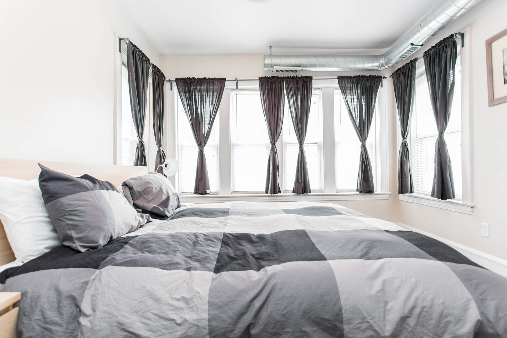 4136 West Palmer Street Chicago, IL 60639 - Photo 27 of 35 a bedroom with a large bed and a large window