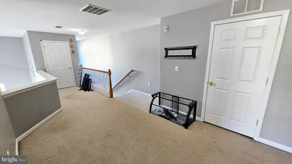 wooden floor with windows and hardwood floor