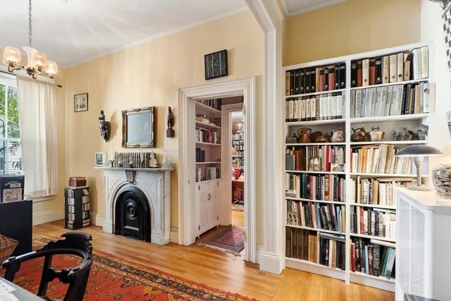 a view of living room with furniture and book shelf