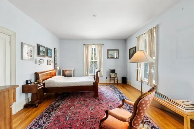 a bedroom with furniture and a window