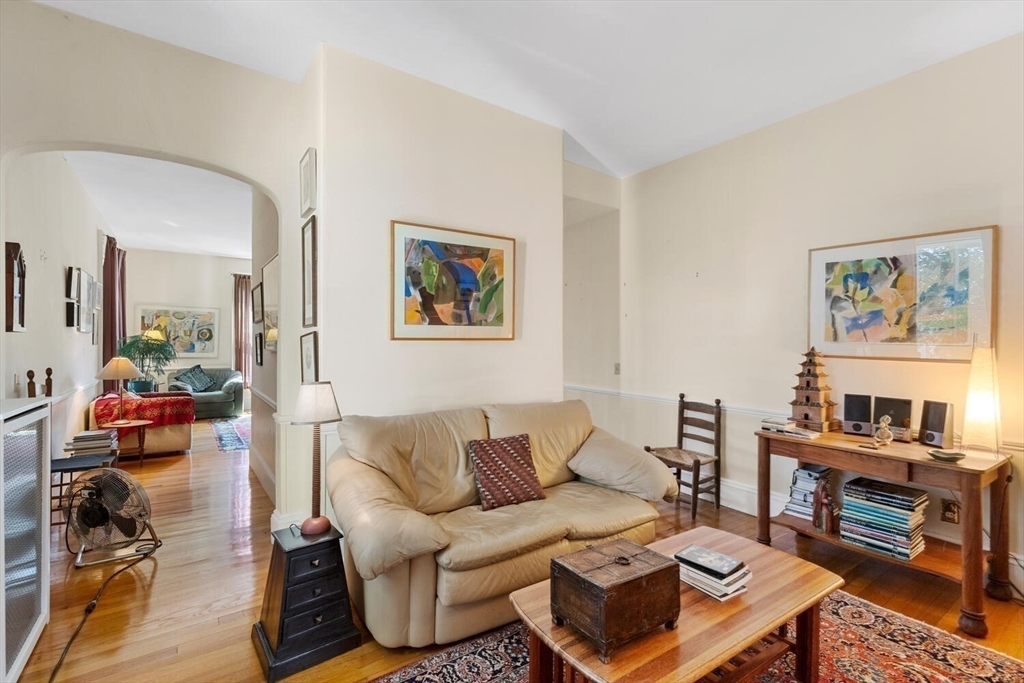 41 Dearborn Street Salem, MA 01970 - Photo 24 of 37 a living room with furniture a rug and a wall painting