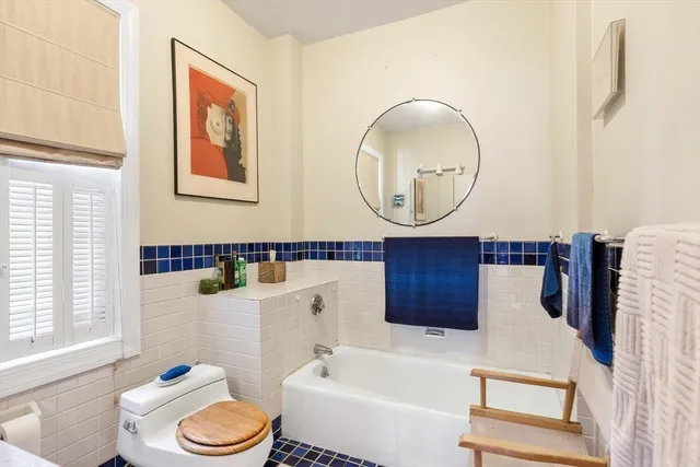 a bathroom with a toilet a sink and a bathtub
