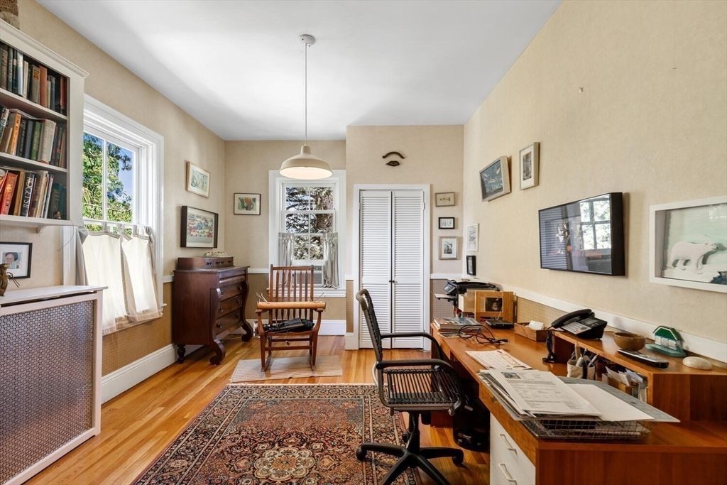 41 Dearborn Street Salem, MA 01970 - Photo 30 of 37 a view of a workspace with furniture and a livingroom