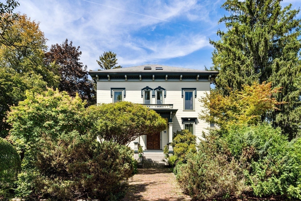 41 Dearborn Street Salem, MA 01970 - Photo 3 of 37 a front view of a house with a yard