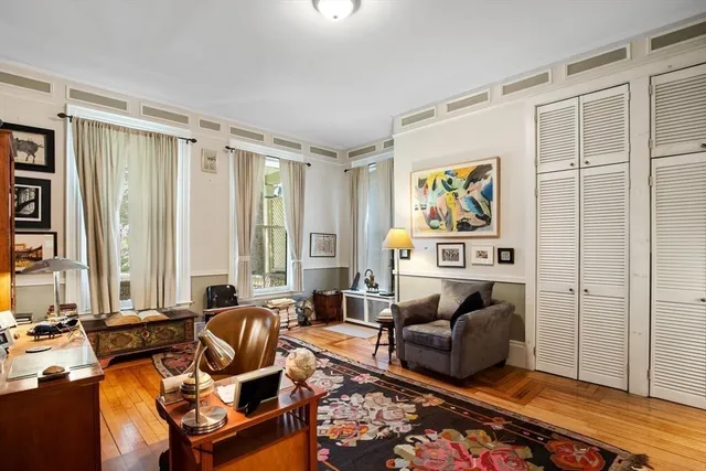 a living room with furniture floor and a window