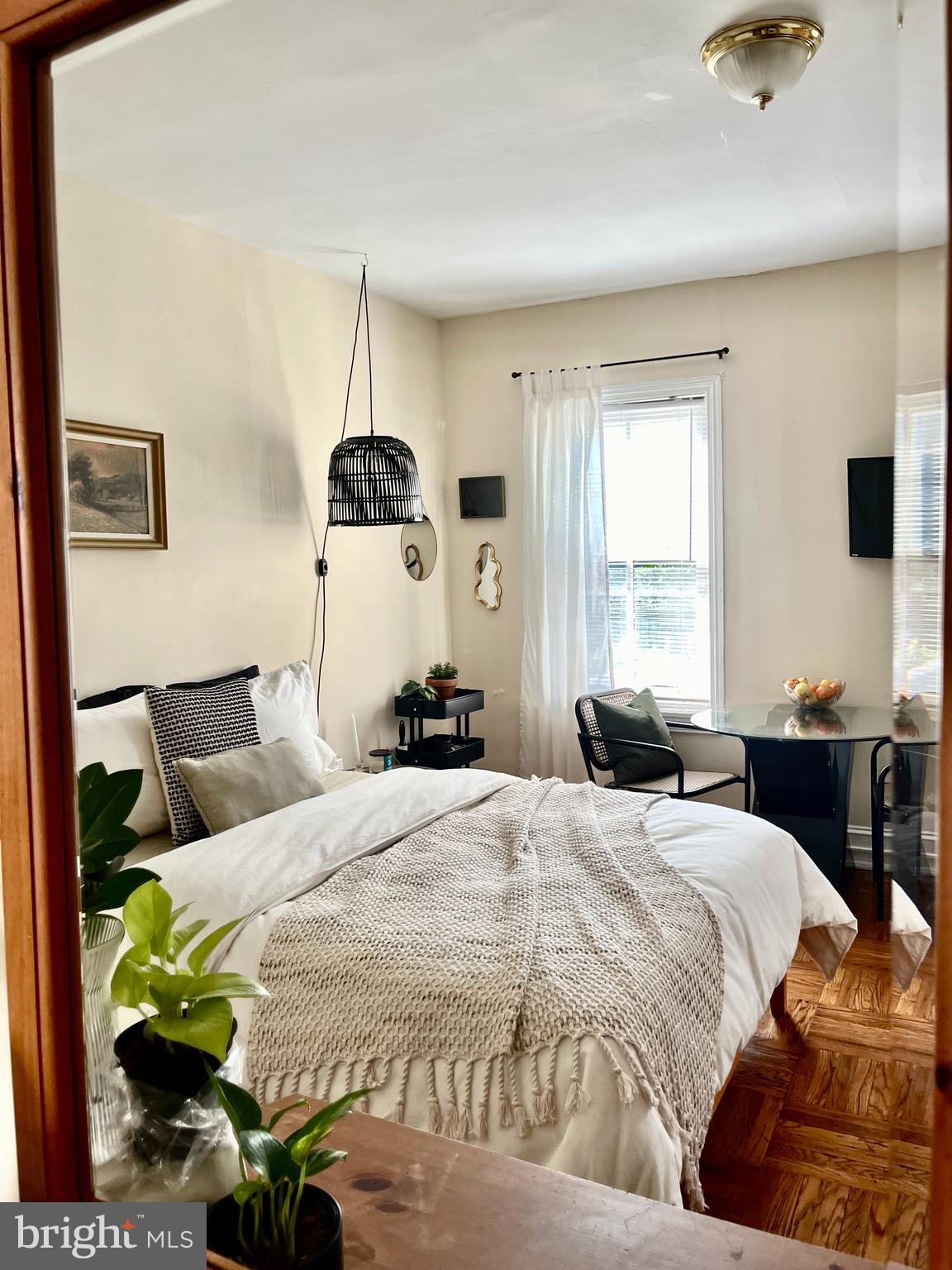 4253 Ridge Avenue, Unit 3R Philadelphia, PA 19129 - Photo 3 of 9 a bedroom with a bed and a window