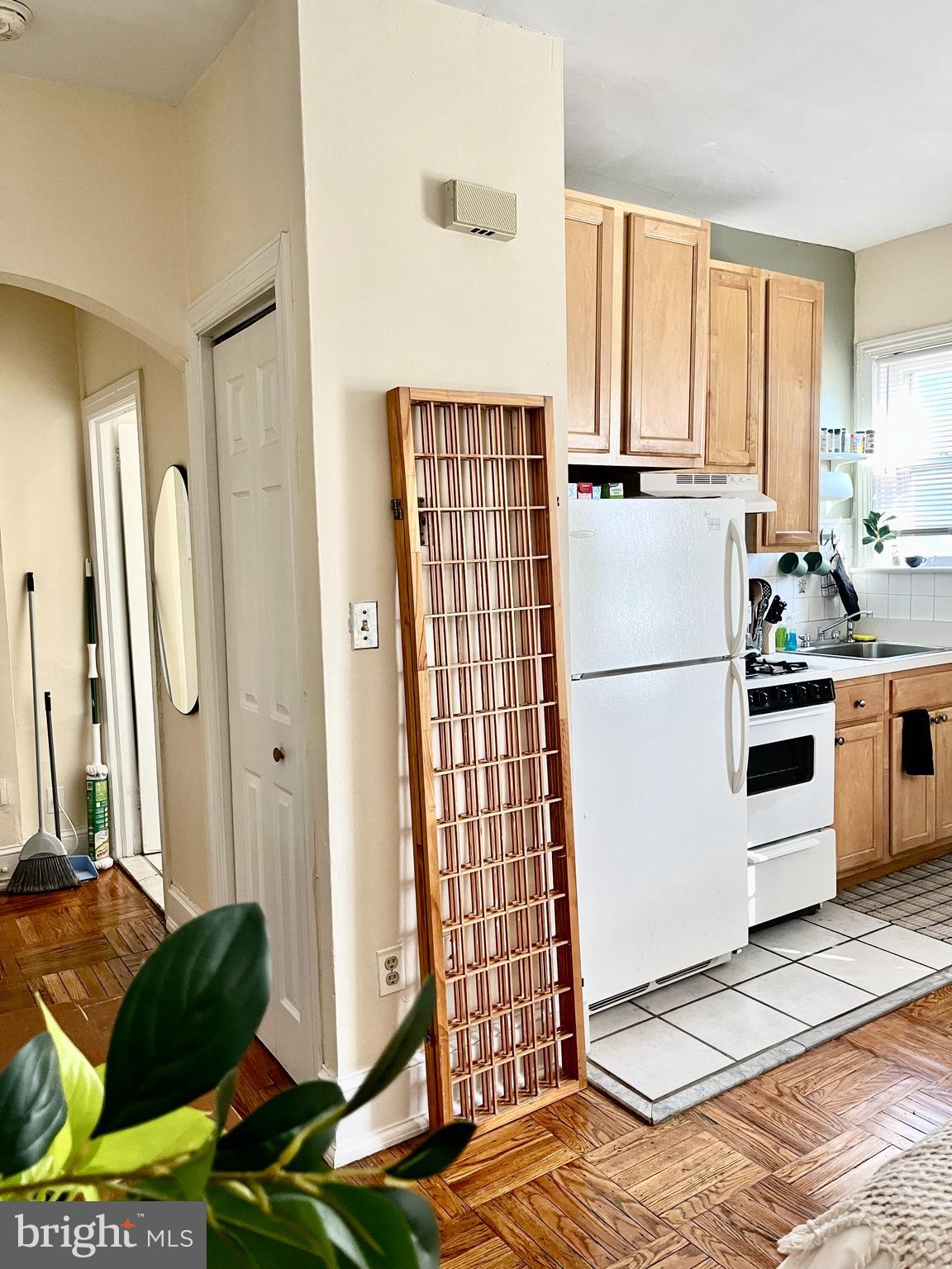 4253 Ridge Avenue, Unit 3R Philadelphia, PA 19129 - Photo 5 of 9 a kitchen with stainless steel appliances granite countertop a refrigerator sink and cabinets
