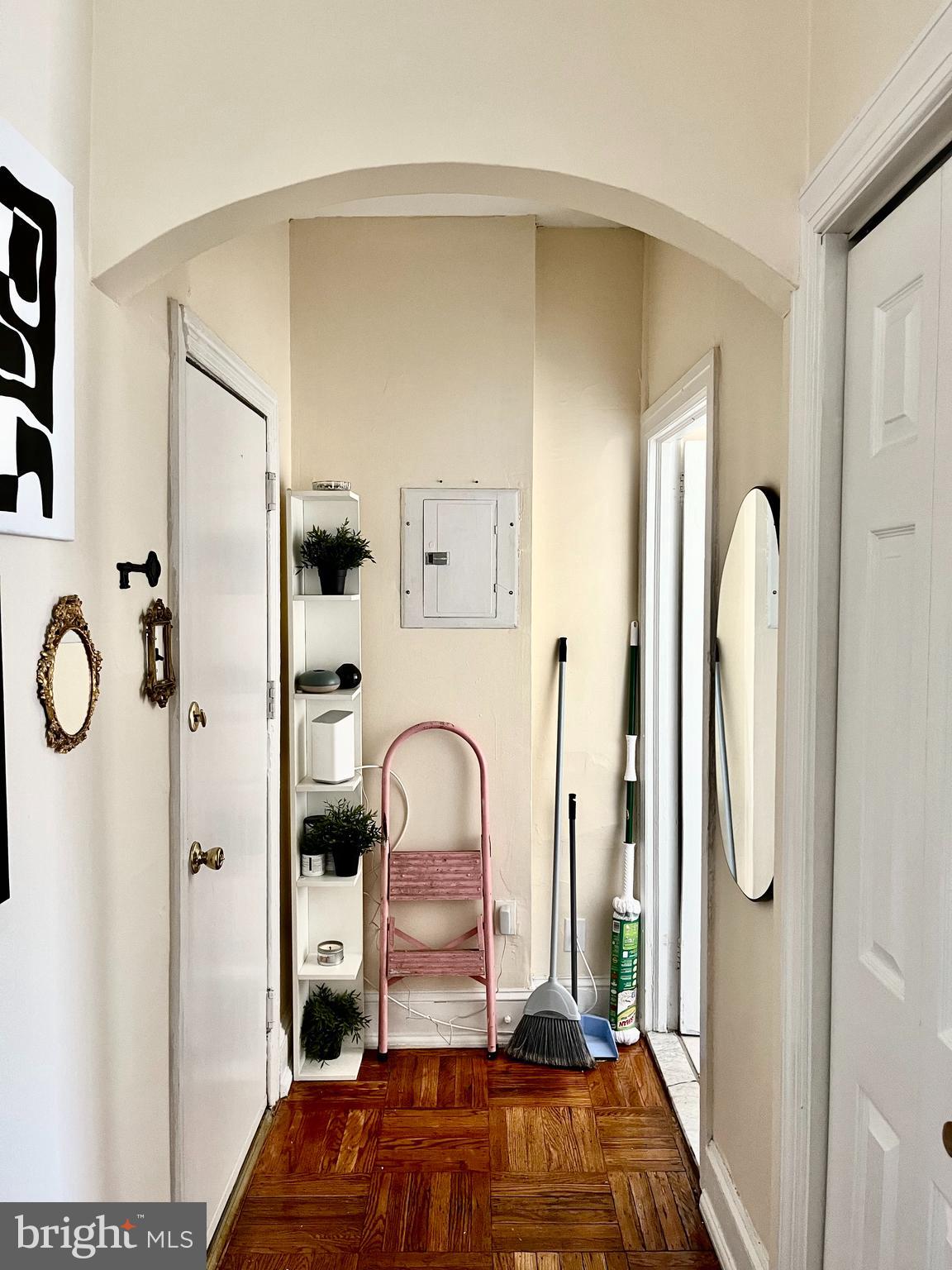 4253 Ridge Avenue, Unit 3R Philadelphia, PA 19129 - Photo 7 of 9 a bedroom with a bed and a mirror