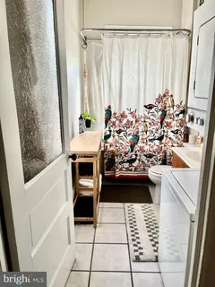 a view of a bathroom with tub and sink