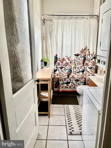 a view of a bathroom with tub and sink
