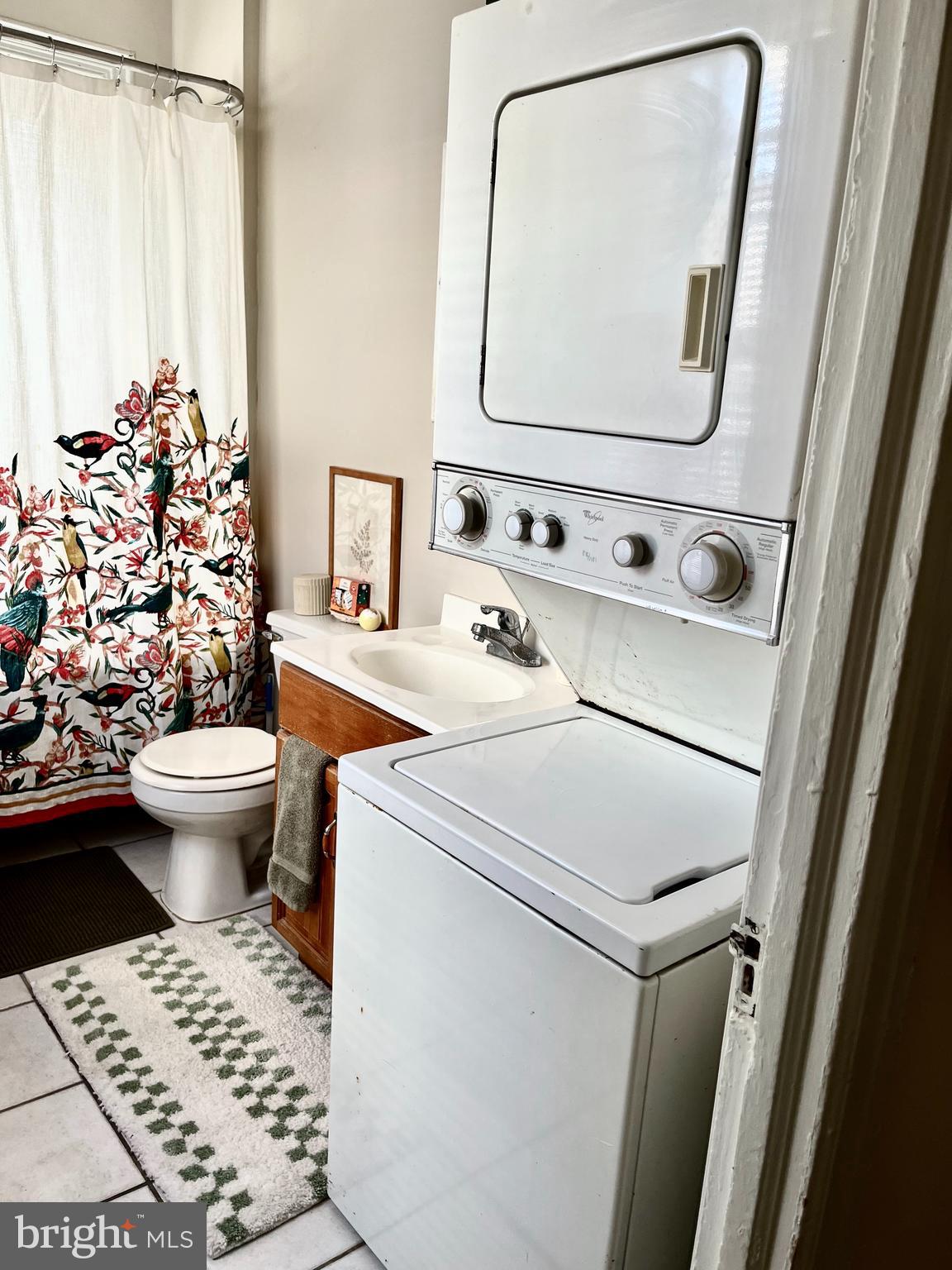 4253 Ridge Avenue, Unit 3R Philadelphia, PA 19129 - Photo 9 of 9 a bathroom with a sink toilet and mirror