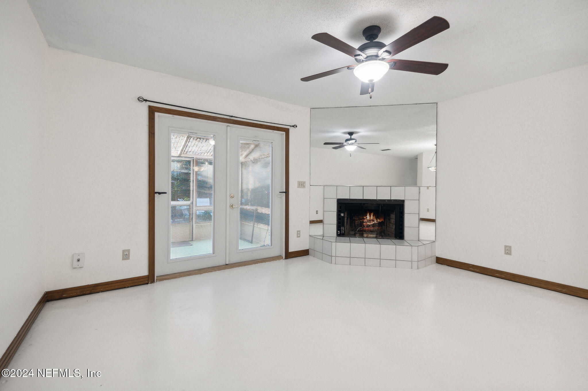 10800 Old St Augustine Road, Unit 204 Jacksonville, FL 32257 - Photo 30 of 30 a view of an empty room with a fireplace