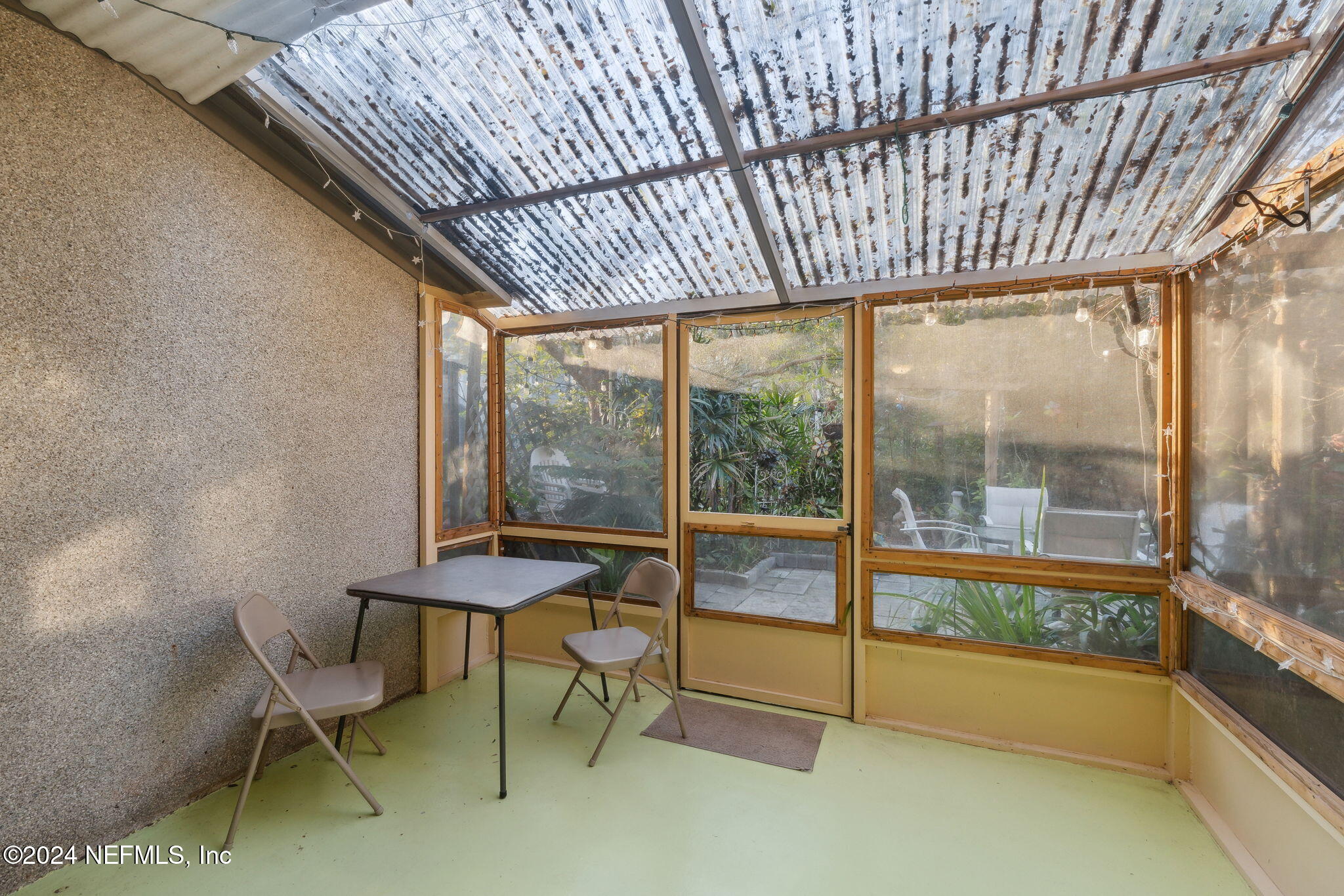 10800 Old St Augustine Road, Unit 204 Jacksonville, FL 32257 - Photo 19 of 30 a view of a room with a table and chairs