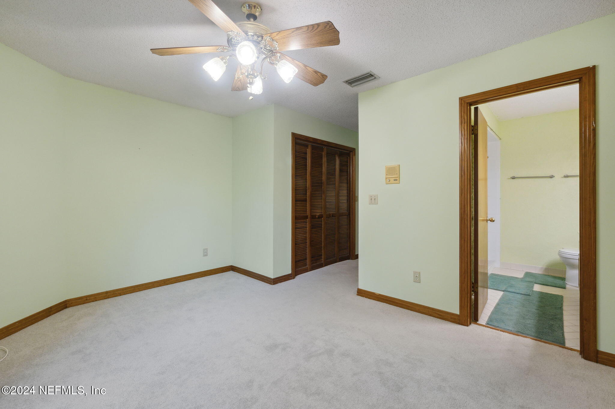 10800 Old St Augustine Road, Unit 204 Jacksonville, FL 32257 - Photo 24 of 30 an empty room with fan and entrance