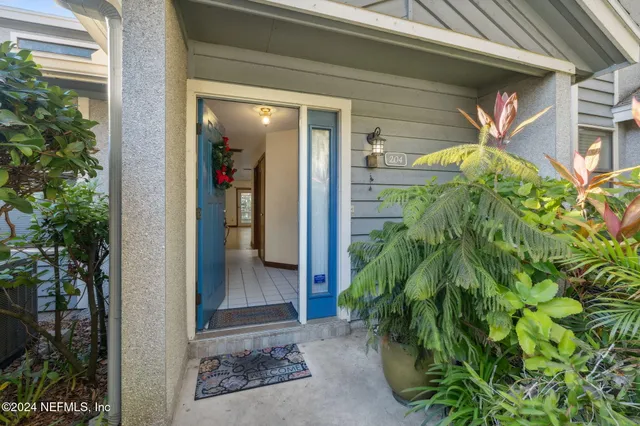 a kitchen with stainless steel appliances granite countertop a refrigerator a stove a sink and a microwave