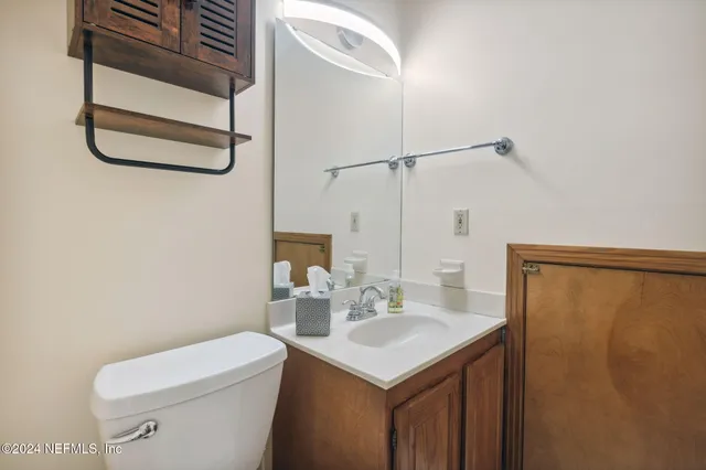a kitchen with stainless steel appliances a refrigerator and a stove top oven
