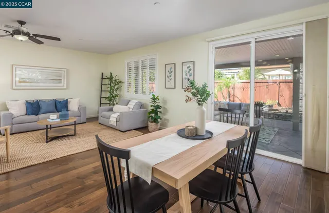 a view of a dining room with furniture window and wooden floor