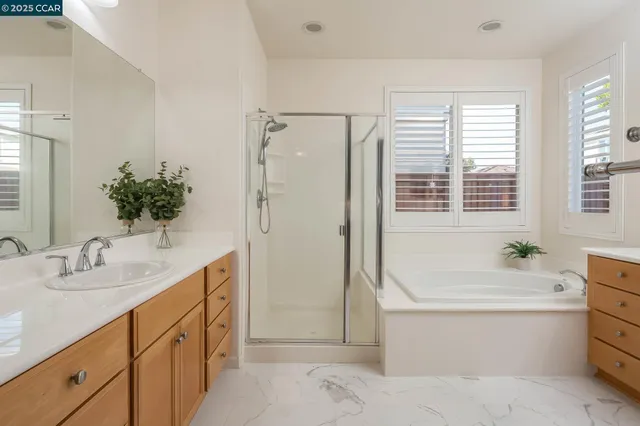 a bathroom with a tub sink toilet and a bath tub