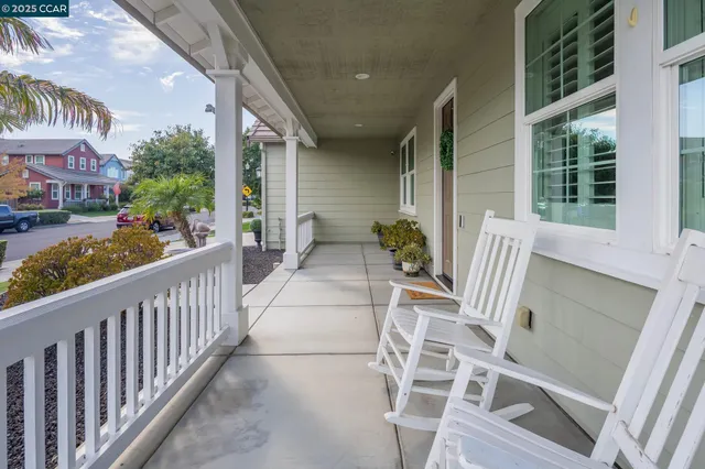 a view of an chairs and tables in the balcony
