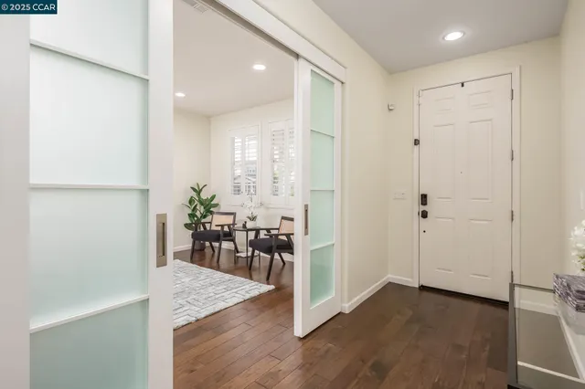 a view of a dining area with furniture and wooden floor