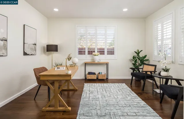 a living room with furniture a window and a table