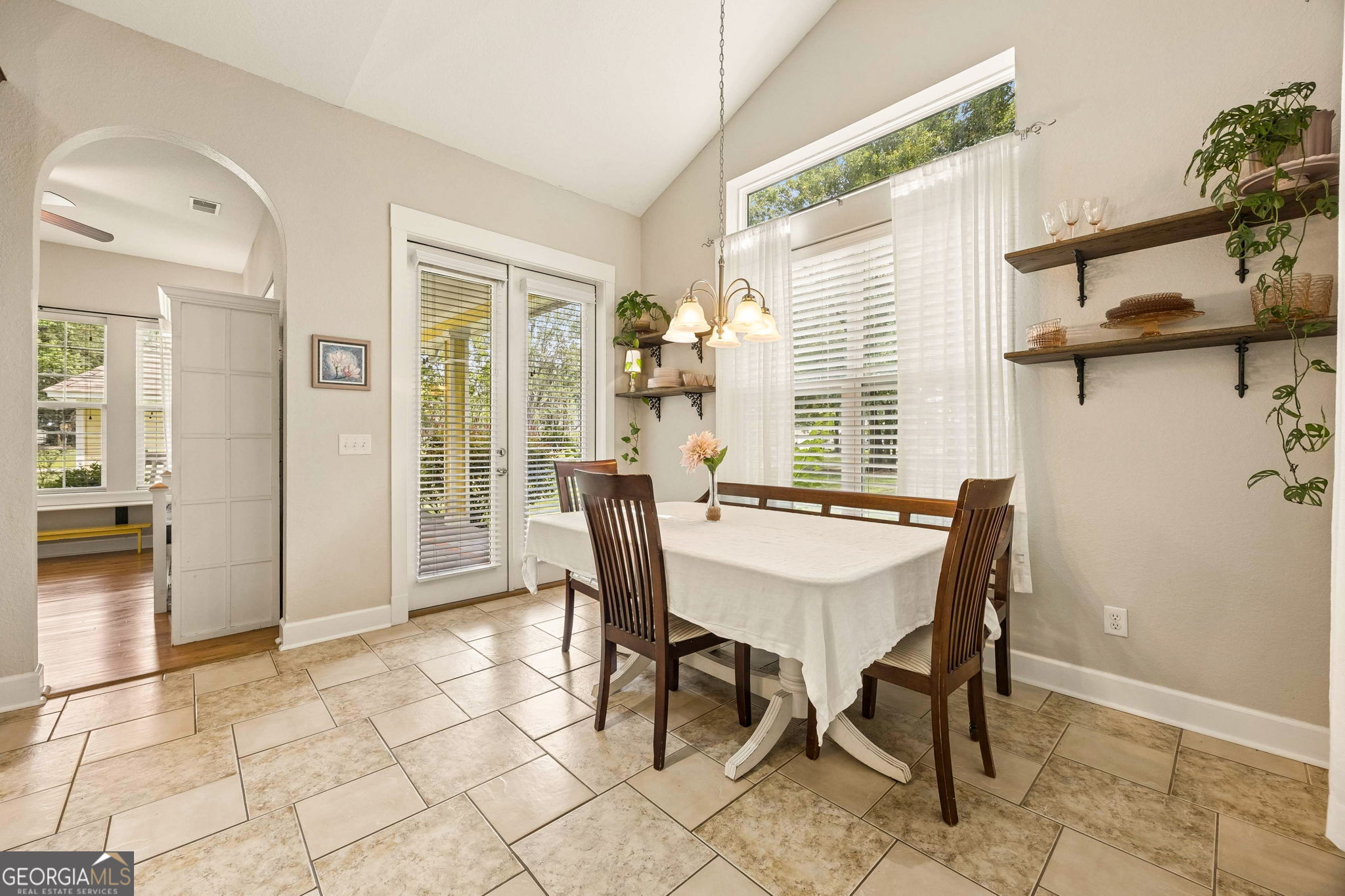 706 Hopewell Point Road White Oak, GA 31568 - Photo 25 of 84 Enjoy casual meals surrounded by natural light with convenient access to the covered outdoor living space just steps away.