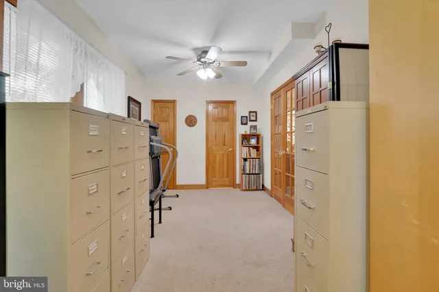 a view of a kitchen with closet and workspace