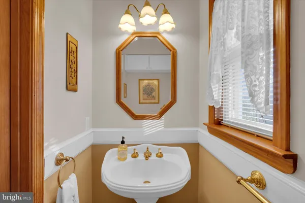 a bathroom with a sink a mirror and a bathtub