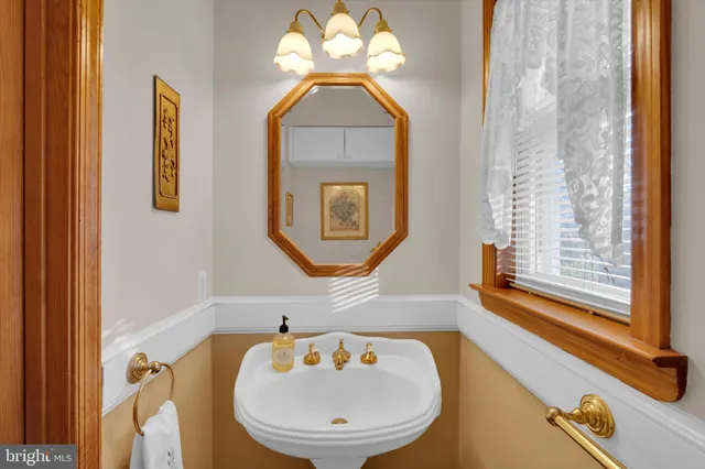 a bathroom with a sink a mirror and a bathtub