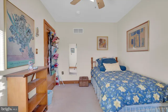 a bedroom with a bed and a couch