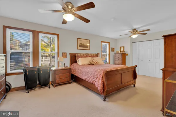 a bedroom with a bed furniture and a window