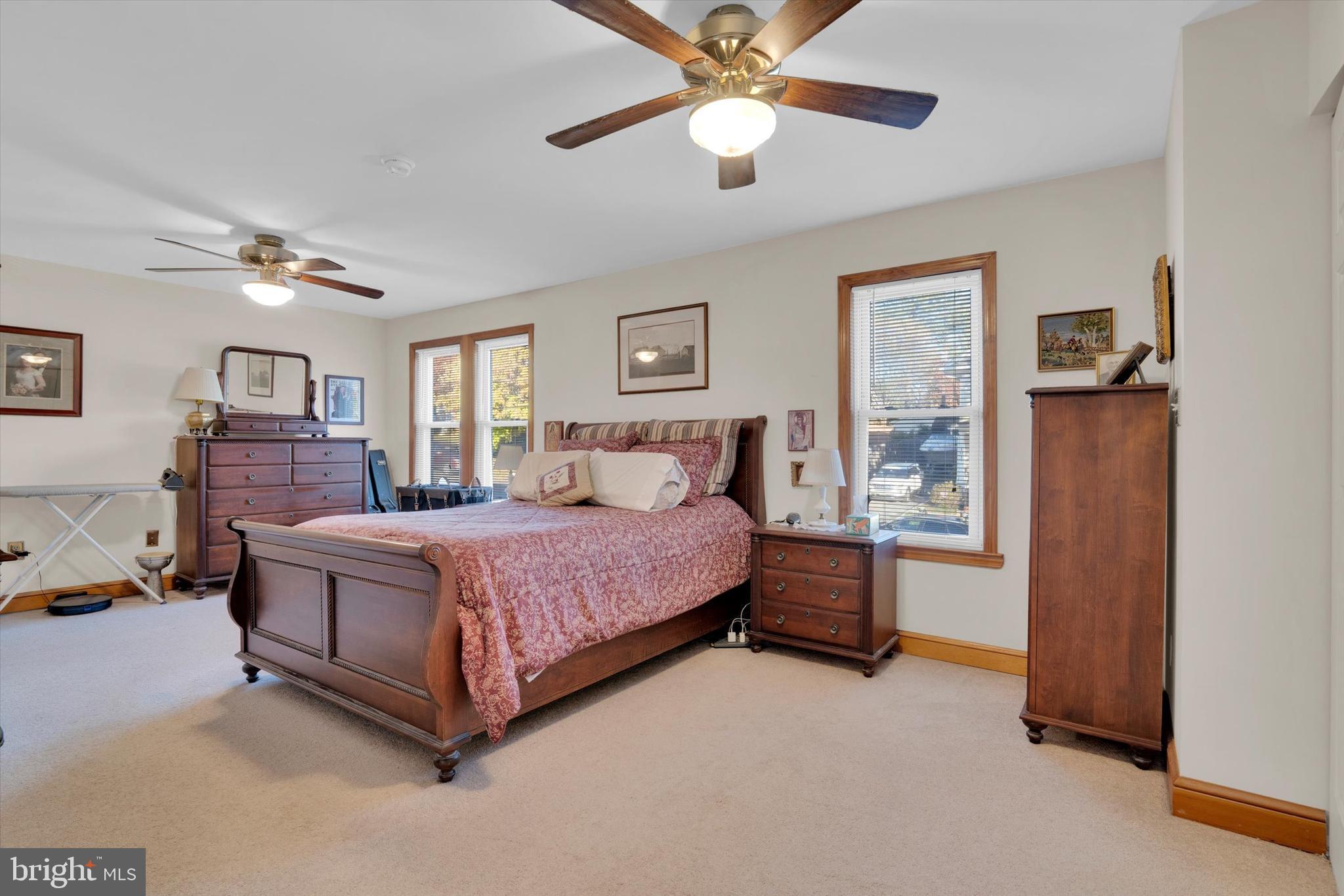 102 Catalpa Road Linthicum Heights, MD 21090 - Photo 34 of 49 a bedroom with a bed and a chandelier