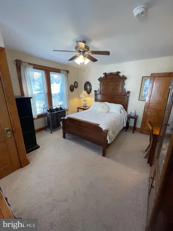 a bedroom with bed and window