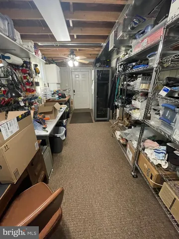 a room with gym equipment and racks