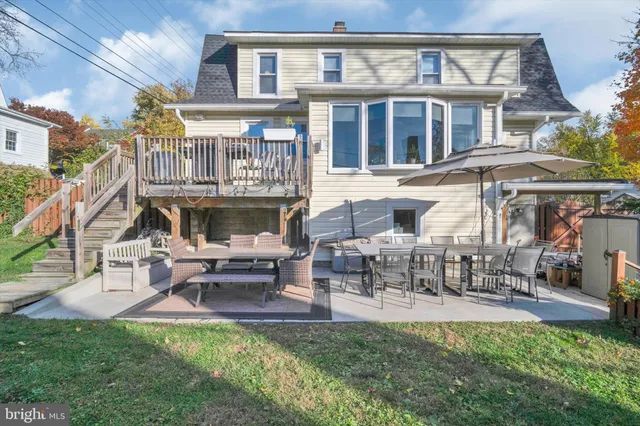 a front view of a building with outdoor seating