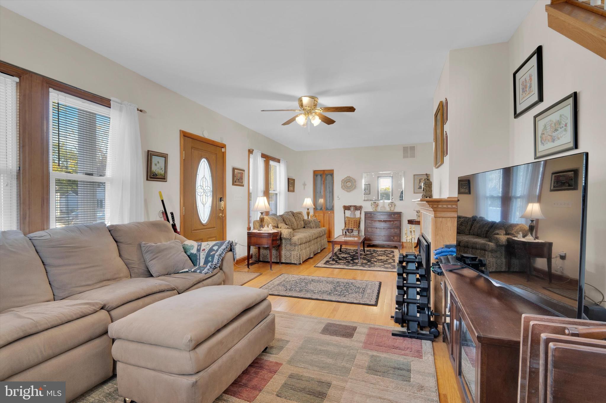 102 Catalpa Road Linthicum Heights, MD 21090 - Photo 10 of 49 a living room with furniture fireplace and a chandelier