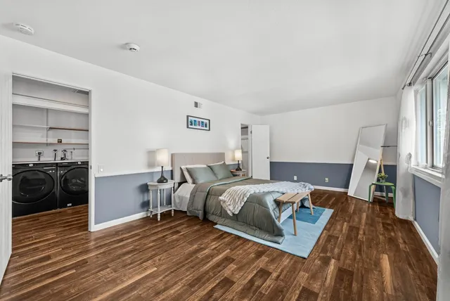 a bed room with a bed and a view of bedroom