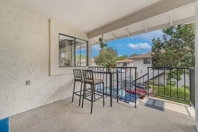a view of balcony with furniture