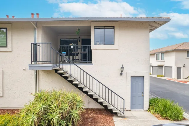 a view of a house with wooden stairs
