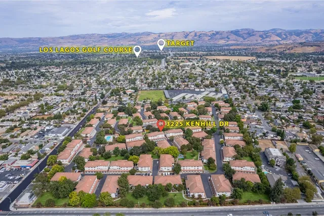 an aerial view of residential houses with outdoor space
