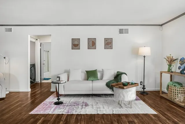 a living room with furniture and a table