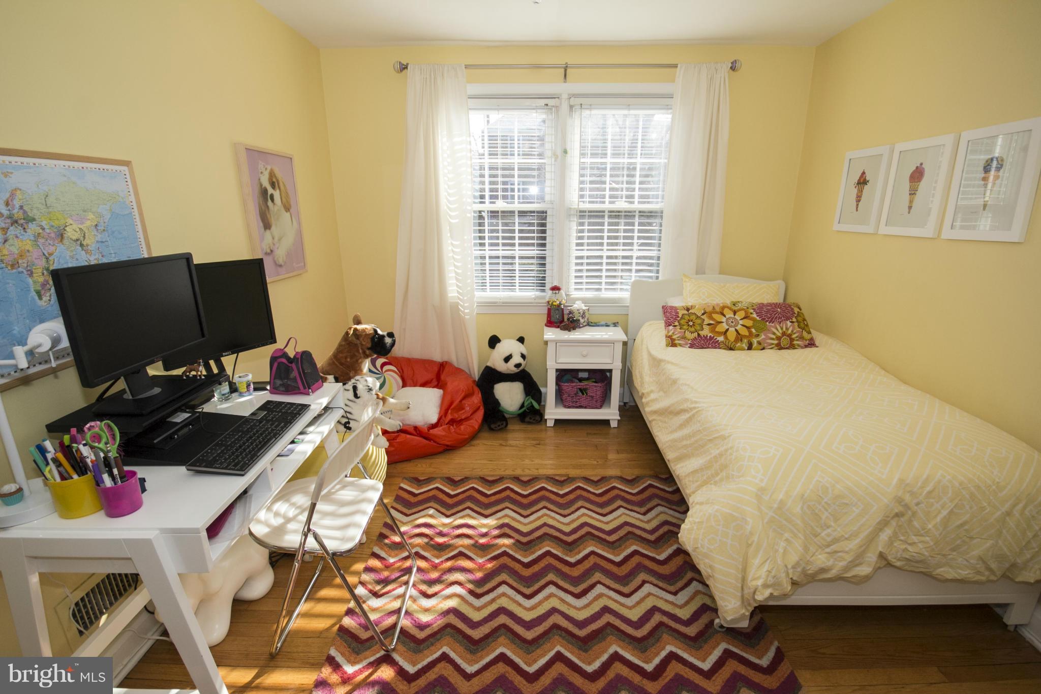 133 Stanmore Road Baltimore, MD 21212 - Photo 14 of 21 a bed room with a bed and a chair