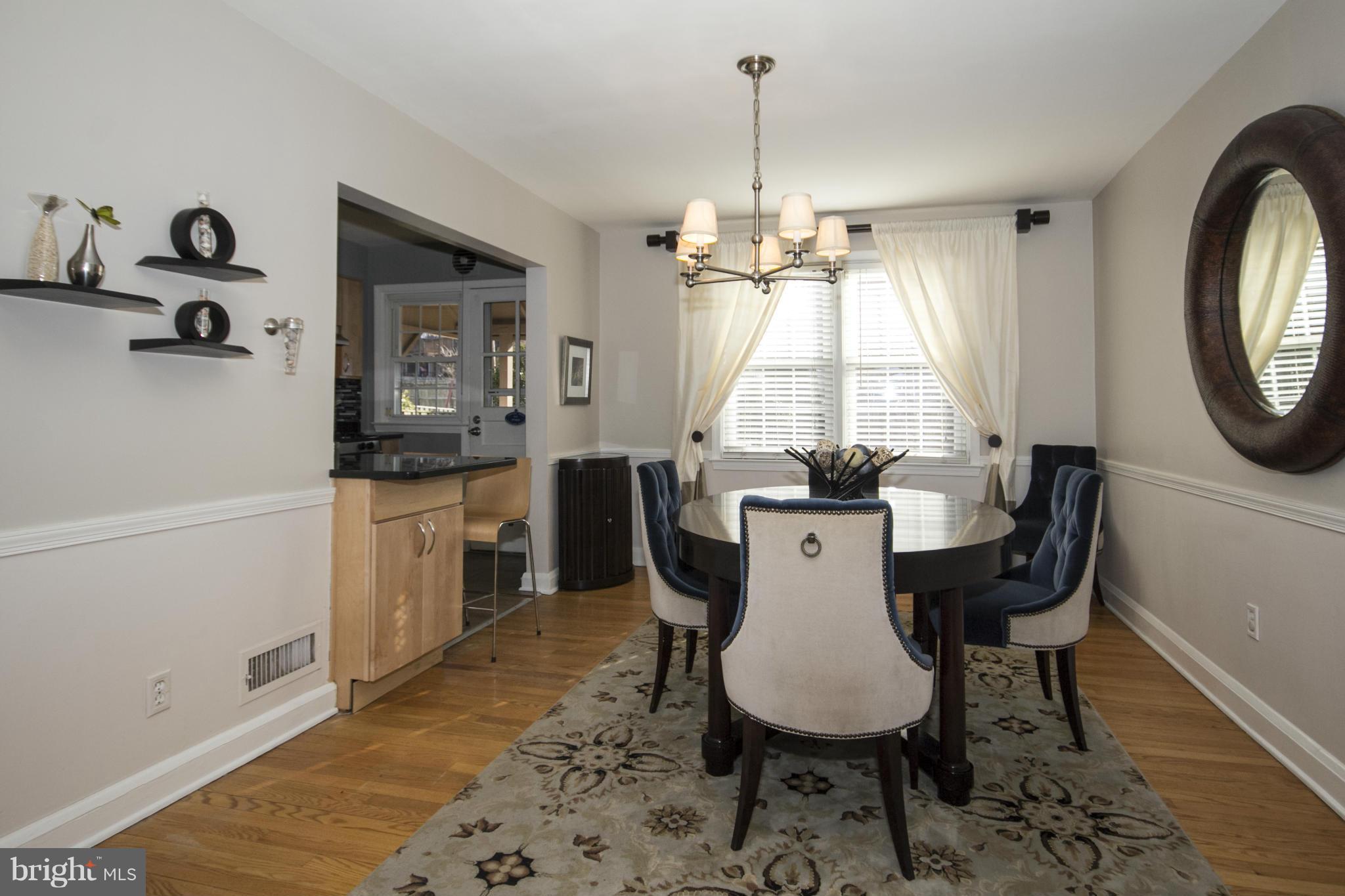 133 Stanmore Road Baltimore, MD 21212 - Photo 8 of 21 a view of a dining room with furniture window and wooden floor