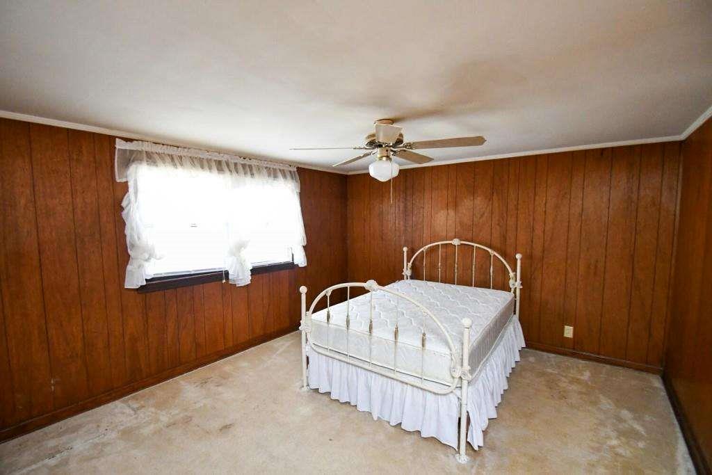 18 Corinth Church Road Cleveland, GA 30528 - Photo 16 of 37 a bedroom with a bed and a dresser