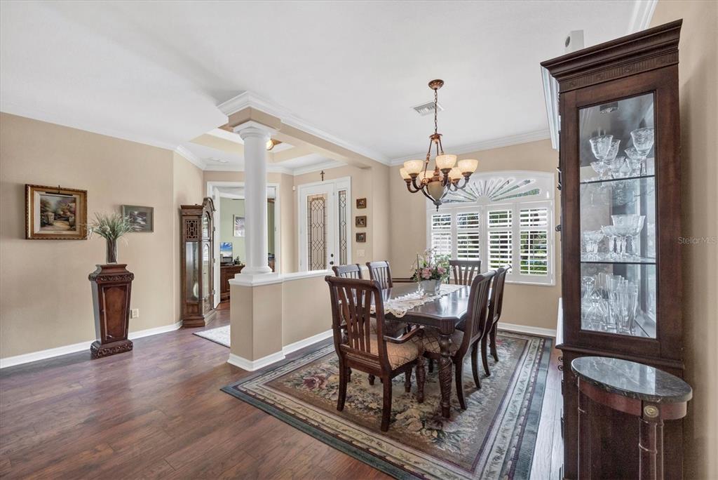 19792 Cobblestone Circle Venice, FL 34292 - Photo 11 of 36 a dining room with furniture window and wooden floor
