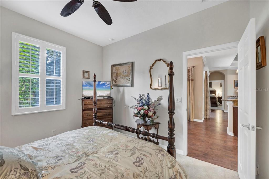 19792 Cobblestone Circle Venice, FL 34292 - Photo 23 of 36 a bedroom with furniture and a window