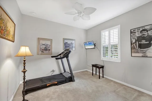a room with gym equipment and a window